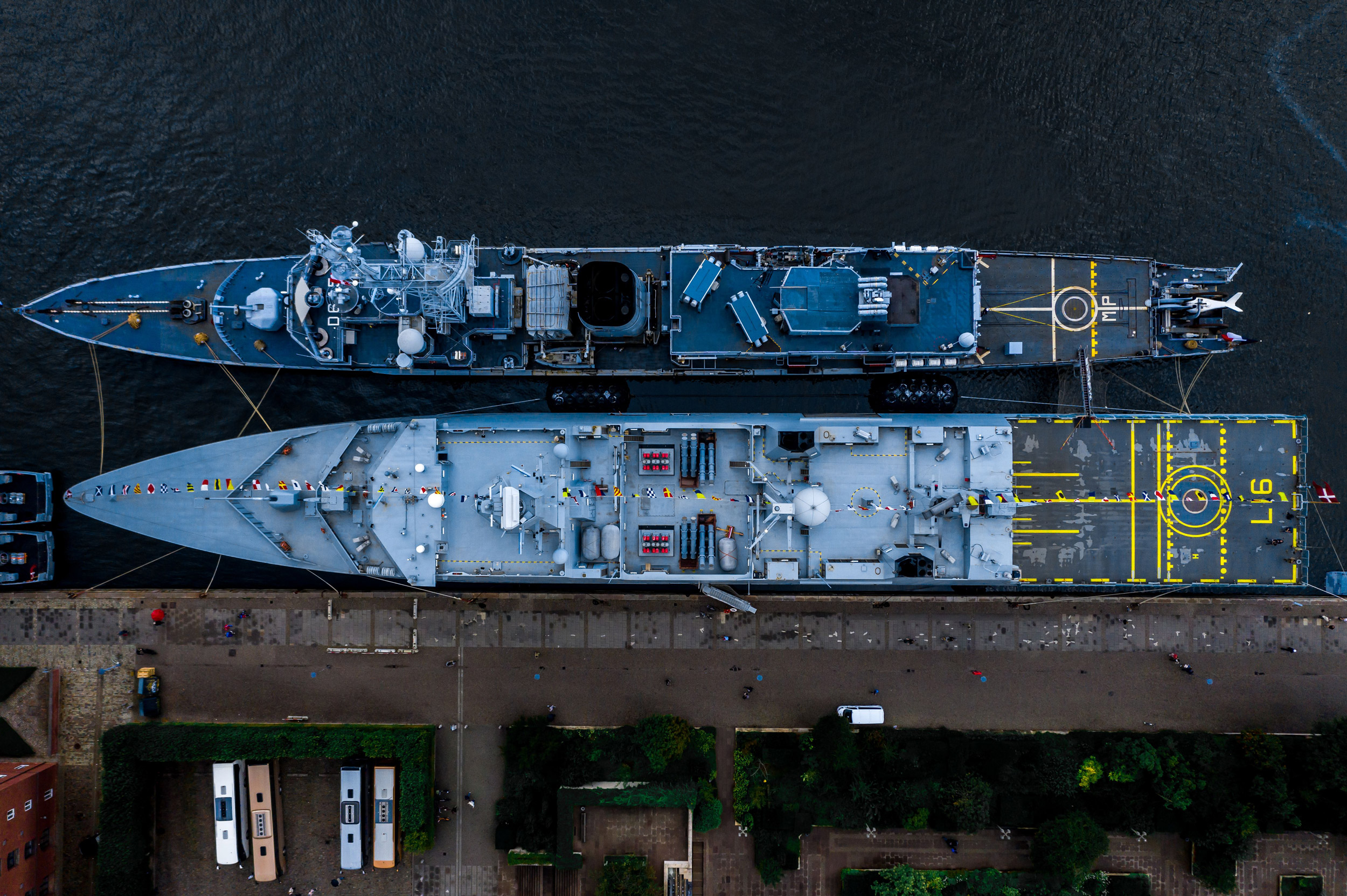 Two docked navy vessels seen from above.