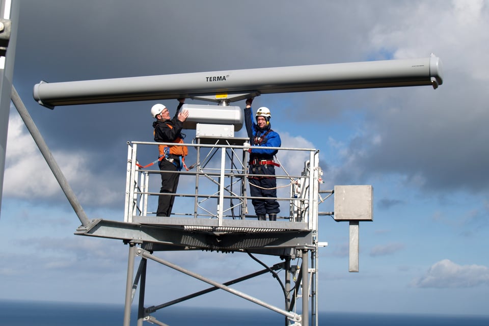 Two Service Engineers performing services on a Terma SCANTER 2000 radar.