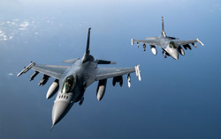 Two F-16 Fighting Falcons in the air.