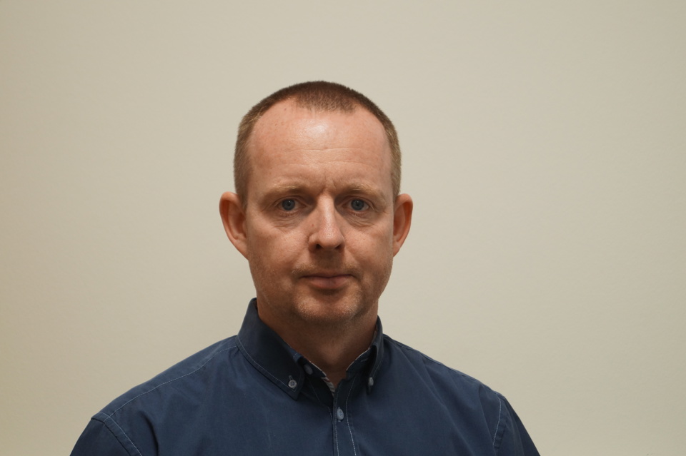 Headshot of Henrik Jensen.