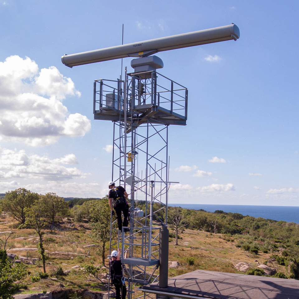 Two technicians performing services on a SCANTER radar on Bornholm in Denmark.