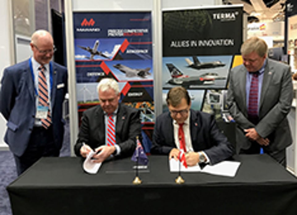 Signing of agreement at the Pacific International Maritime Exposition.