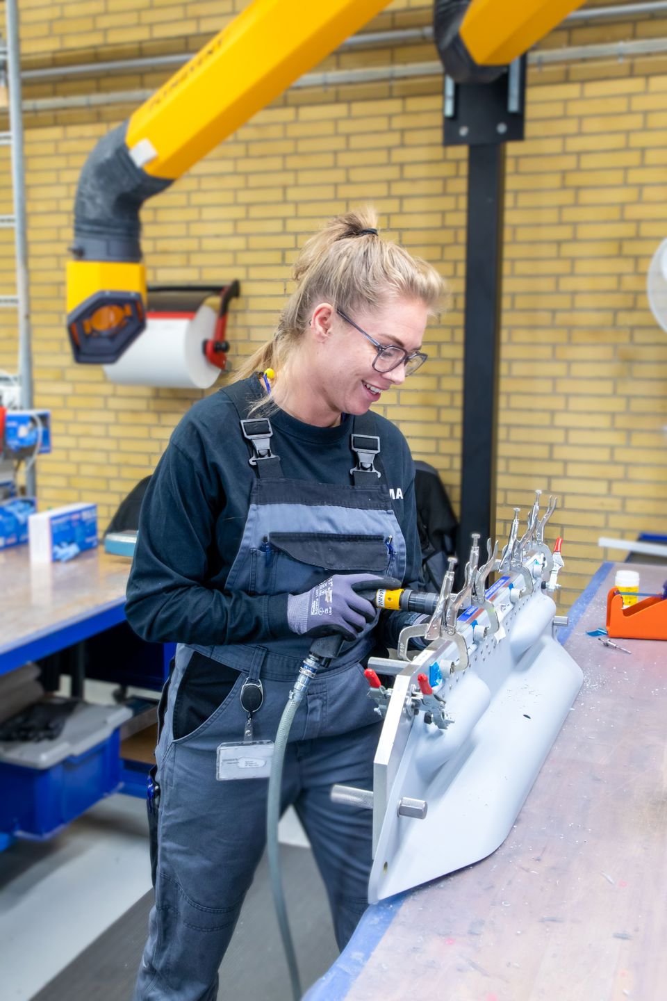 Terma employee performing assembly of an F-35 composite.