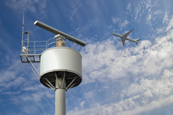 Airplane flying over a radar