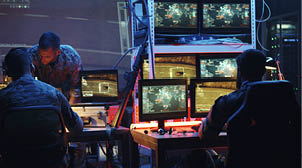 Medium shot of a soldier pointing a handgun at his comrades during rocket launch in a military base; Shutterstock ID 1509841214; purchase_order: AI4DEF; job: mekf; client: ; other: 